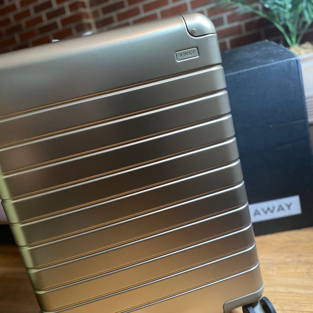 SOLD —Champagne gold medium aluminum Away suitcase